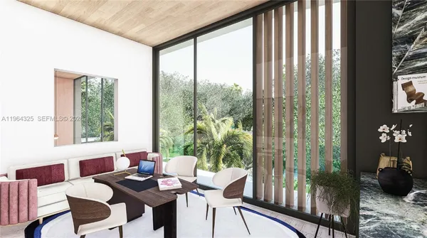 a dining room with furniture and large windows