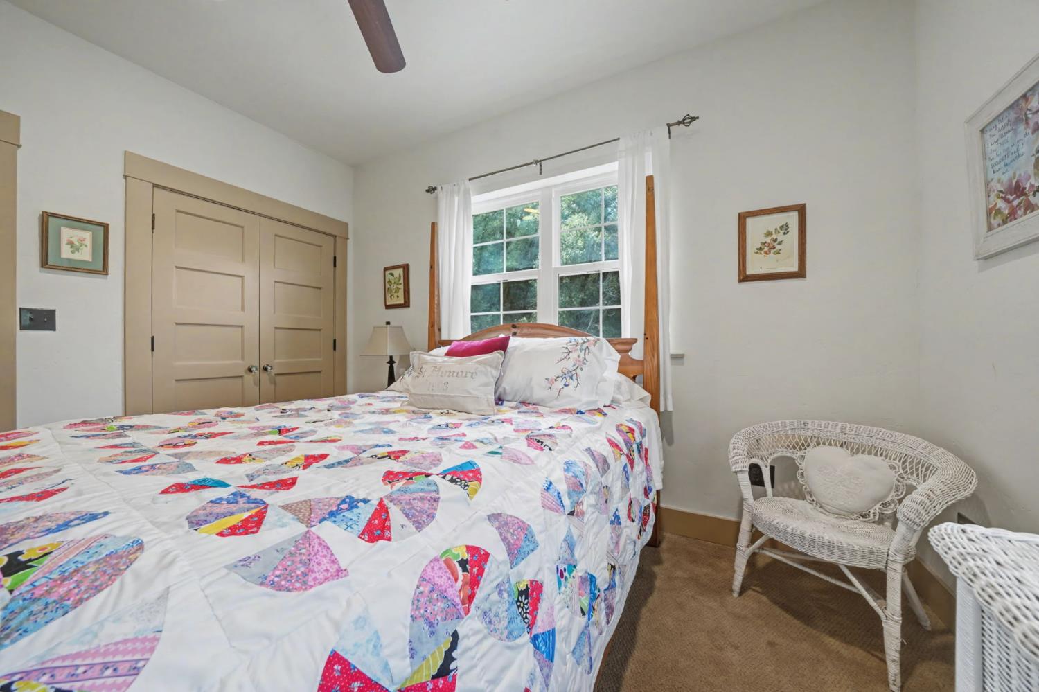 14232 Sutter Creek Road Sutter Creek, CA 95685 - Photo 34 of 57 a bedroom with a bed and a chair