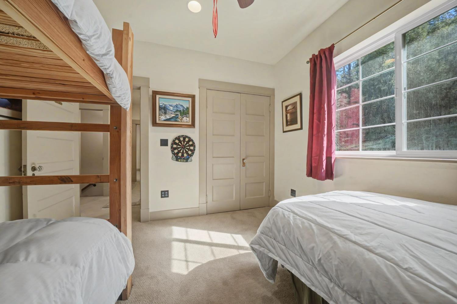 14232 Sutter Creek Road Sutter Creek, CA 95685 - Photo 38 of 57 a bedroom with a large bed and a window