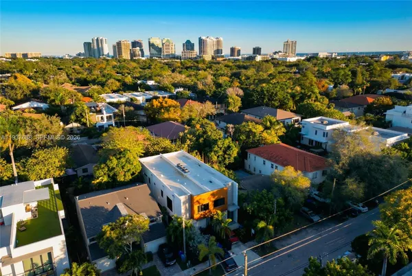 an aerial view of residential houses with outdoor space