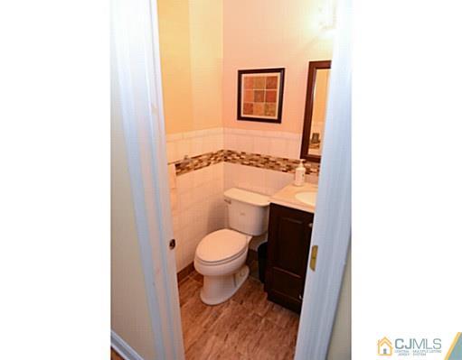 56 Meyer Road Edison, NJ 08817 - Photo 4 of 24 a bathroom with a toilet and a shower