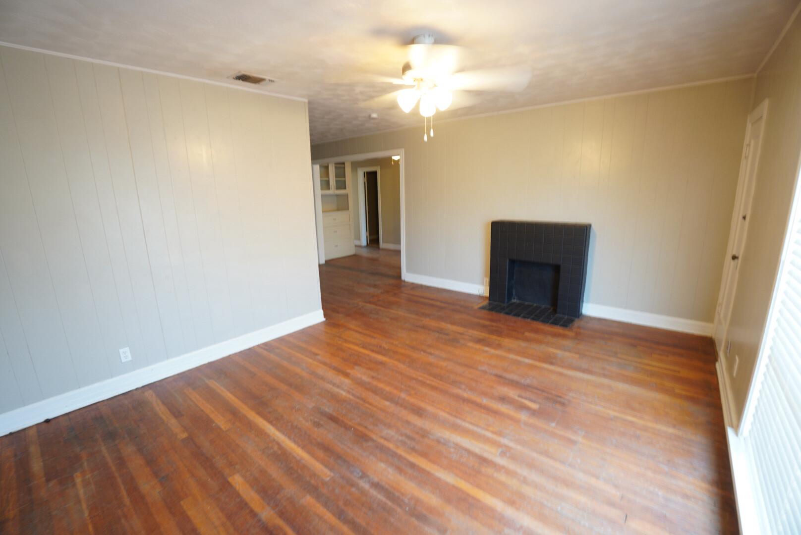 1919 17th Street Lubbock, TX 79401 - Photo 12 of 13 a view of empty room with wooden floor and fan