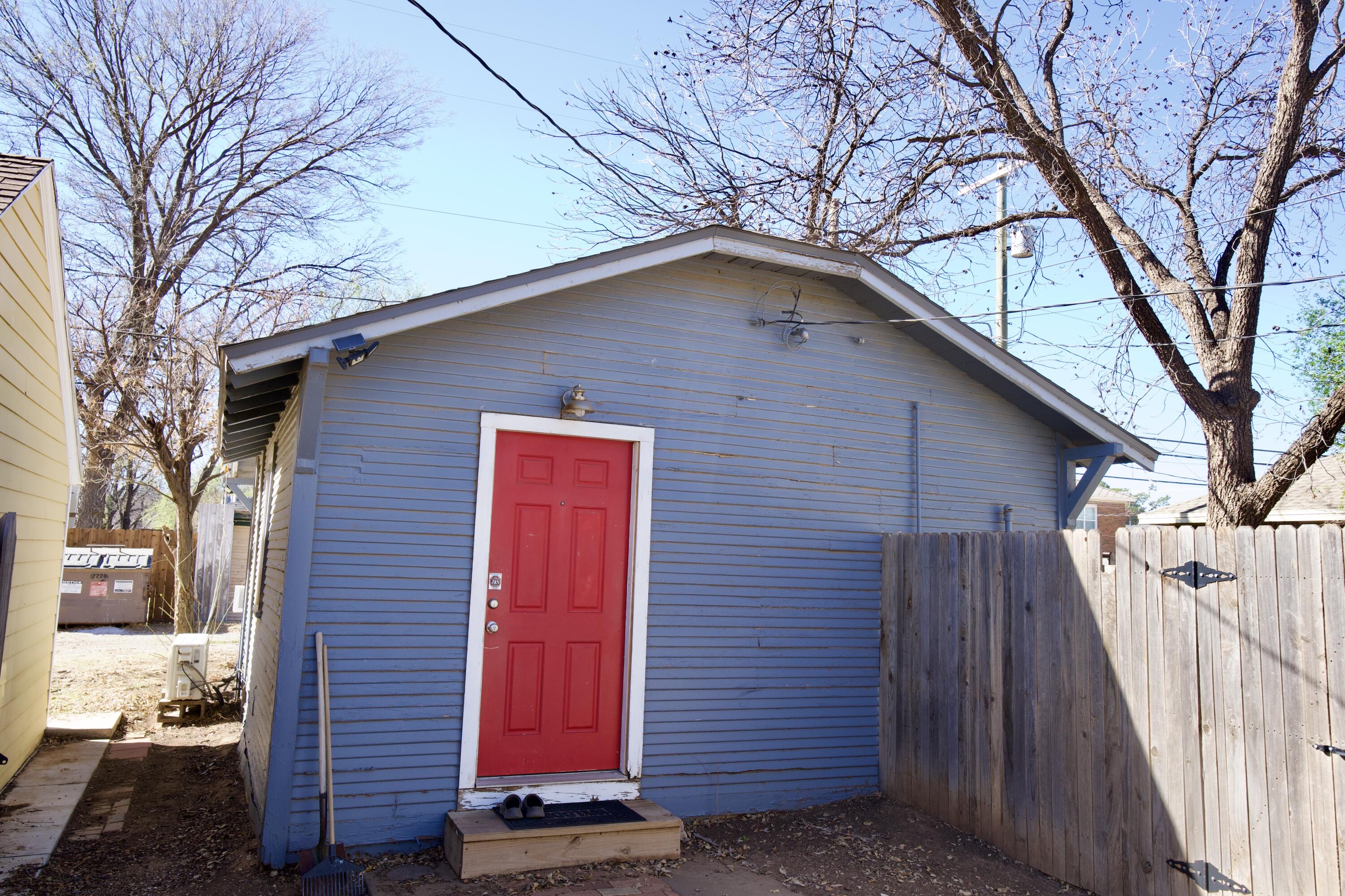1919 17th Street Lubbock, TX 79401 - Photo 5 of 13 a front view of a house with a yard