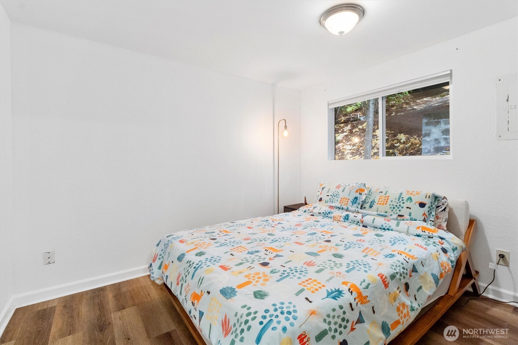 76 B Sudden Valley Drive Bellingham, WA 98229 - Photo 13 of 35 a bedroom with a bed and painting on the wall