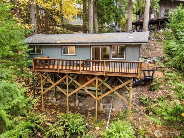 a view of a house with wooden fence