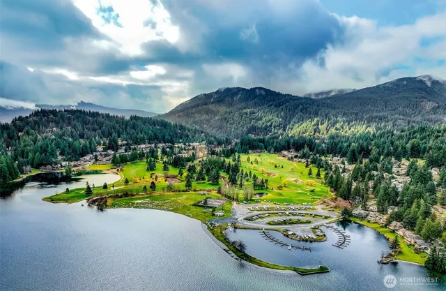 a view of a swimming pool with a yard