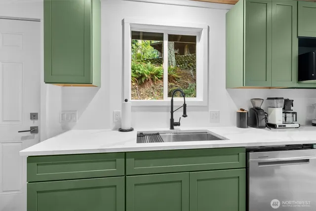 a kitchen with a sink and a window