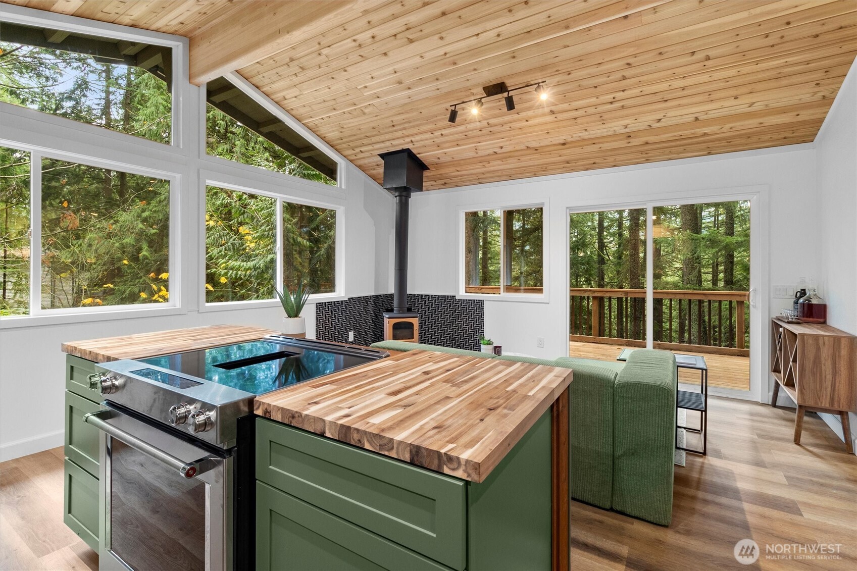 76 B Sudden Valley Drive Bellingham, WA 98229 - Photo 10 of 35 a view of a kitchen with kitchen island a large window in it