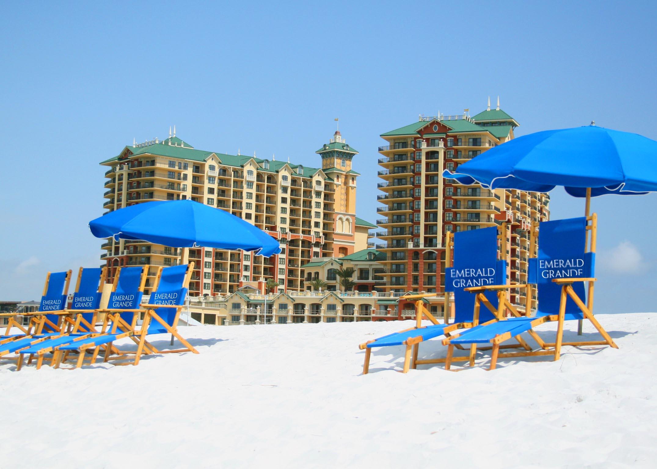 a view of a terrace with furniture and umbrella