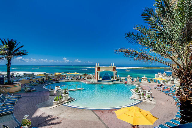 10 Harbor Boulevard, Unit E707H Destin, FL 32541 - Photo 22 of 28 an outdoor space with seating area and swimming pool