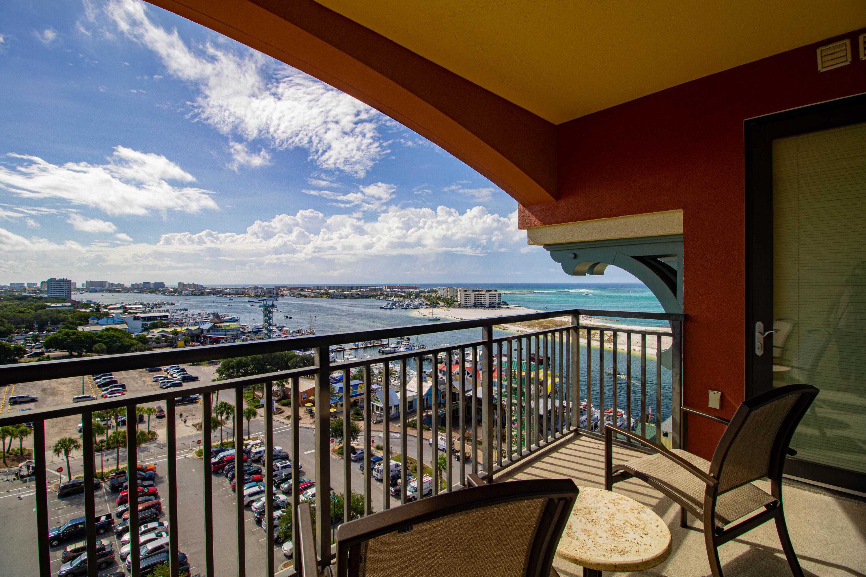 10 Harbor Boulevard, Unit E707H Destin, FL 32541 - Photo 7 of 28 a view of a balcony with wooden floor & fence