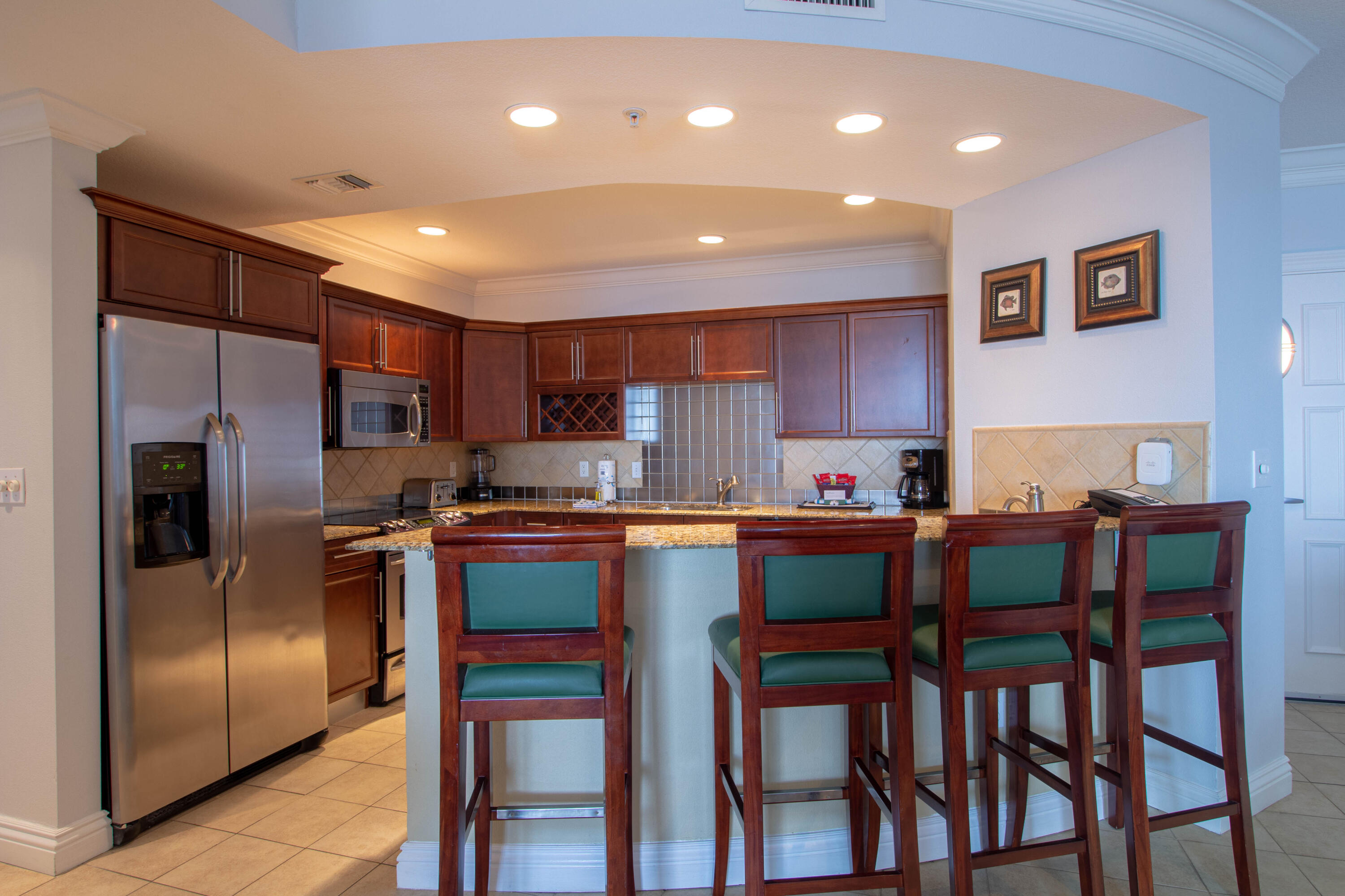 10 Harbor Boulevard, Unit E707H Destin, FL 32541 - Photo 8 of 28 a kitchen with cabinets and stainless steel appliances