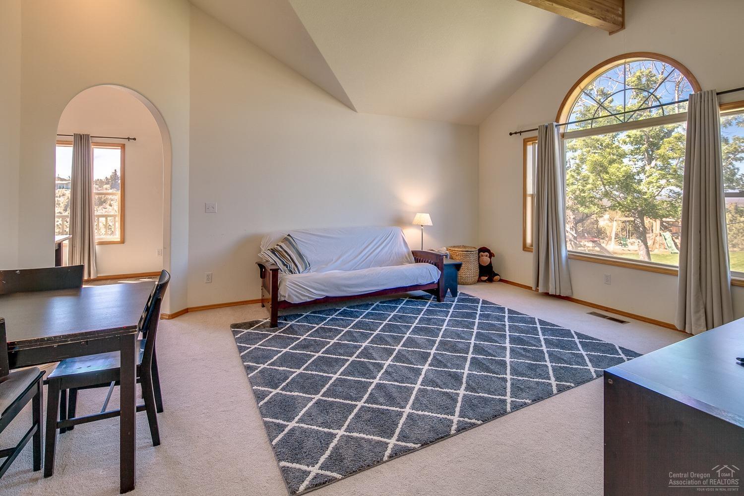 13990 South Sego Lily Road Powell Butte, OR 97753 - Photo 6 of 24 Huge living room with vaulted ceilings a