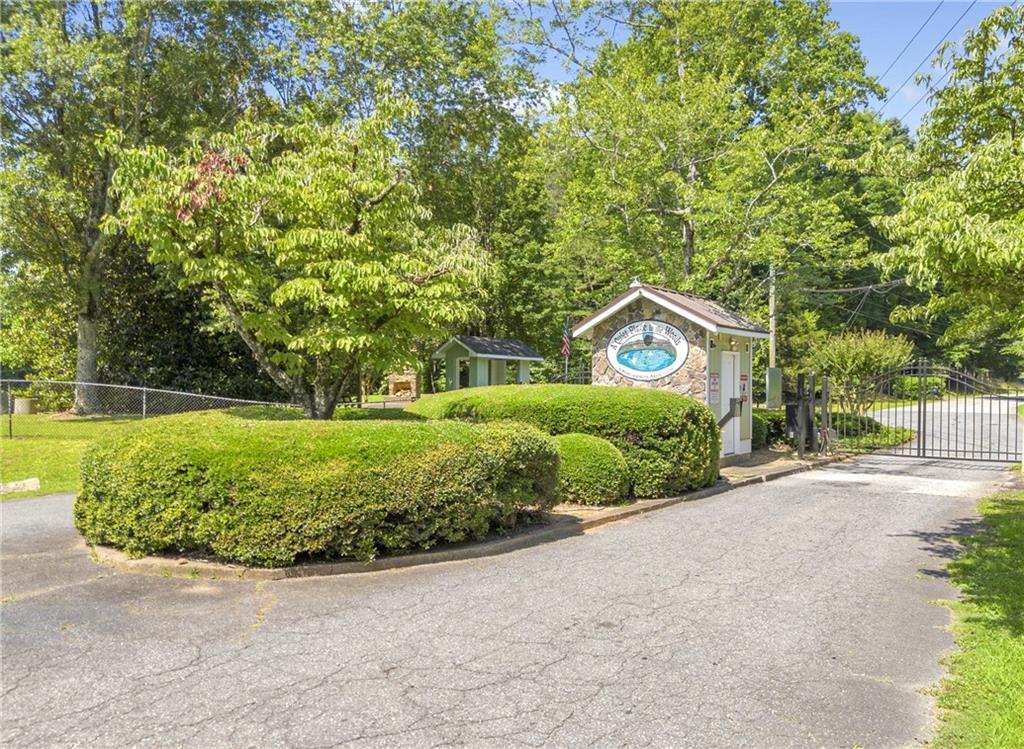 2941 Lake Hollow Road Gainesville, GA 30501 - Photo 49 of 53 a view of a house with a yard and potted plants