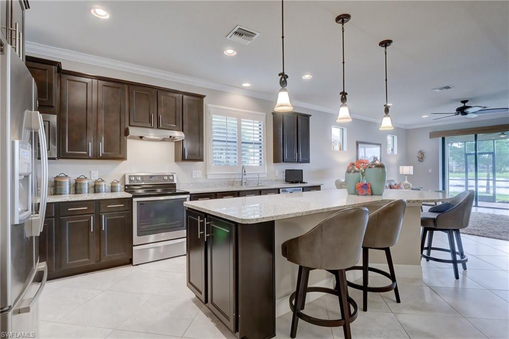 10837 Dennington Road Fort Myers, FL 33913 - Photo 9 of 35 Kitchen with oversized Island and updated Cabinets