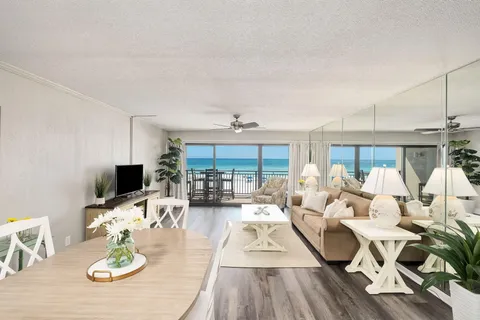 a living room with fireplace furniture and a flat screen tv