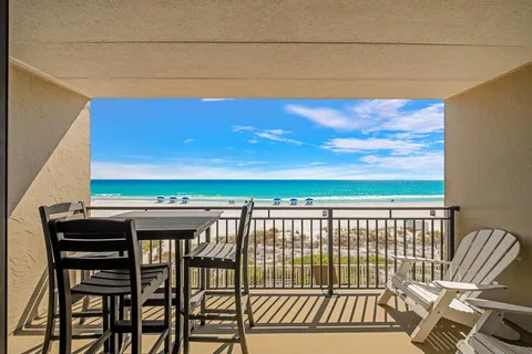 a view of a balcony with chairs