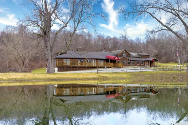 a view of a swimming pool with an outdoor space and seating area