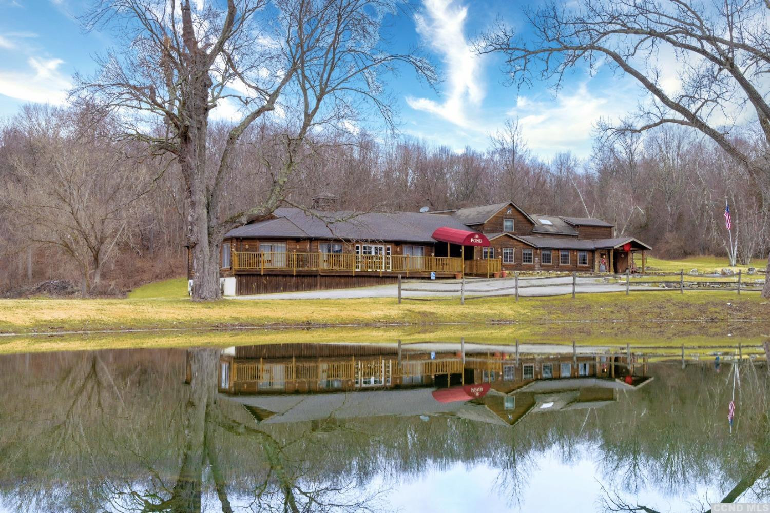 a view of a swimming pool with an outdoor space and seating area