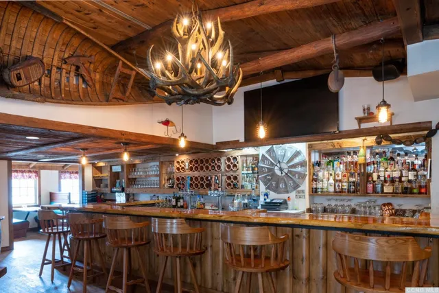 a kitchen with a table and chairs in it