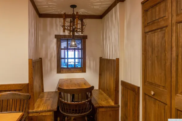 a dining room with furniture and window
