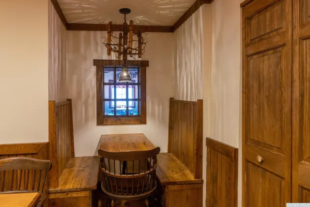 a dining room with furniture and window