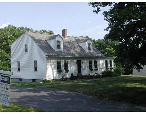 35 Benjamin Road Shirley, MA 01464 - Photo 1 of 13 a front view of a house with a garden and plants