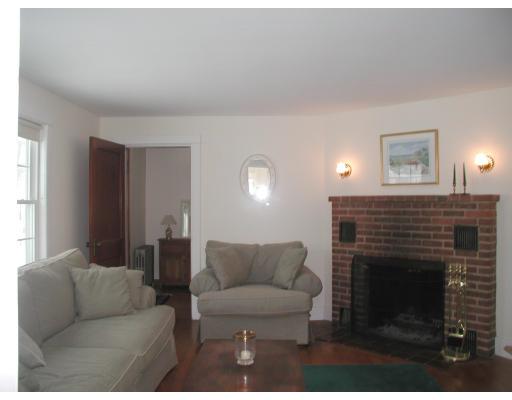 35 Benjamin Road Shirley, MA 01464 - Photo 2 of 13 a living room with furniture a fireplace and a flat screen tv
