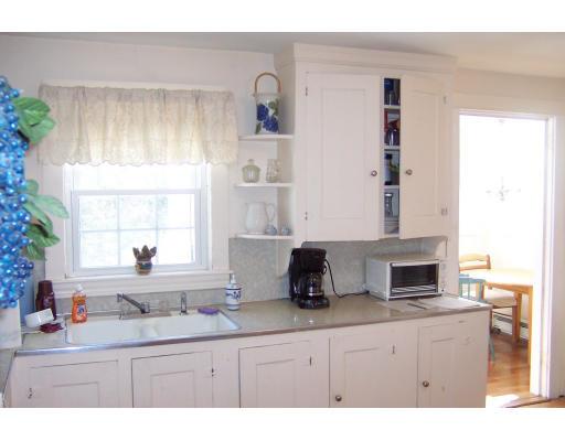35 Benjamin Road Shirley, MA 01464 - Photo 6 of 13 a kitchen with cabinets a window and a sink