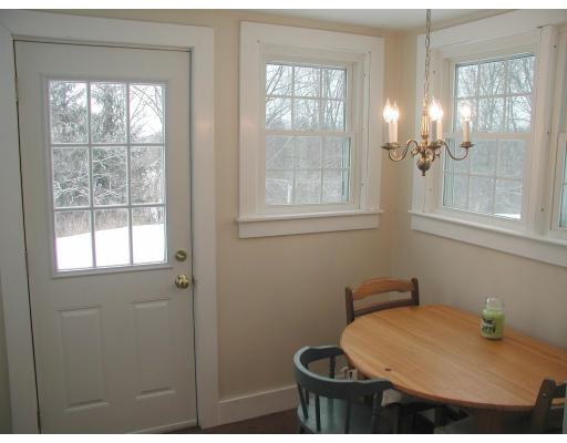 35 Benjamin Road Shirley, MA 01464 - Photo 7 of 13 a bathroom with a sink toilet a mirror and next to a window