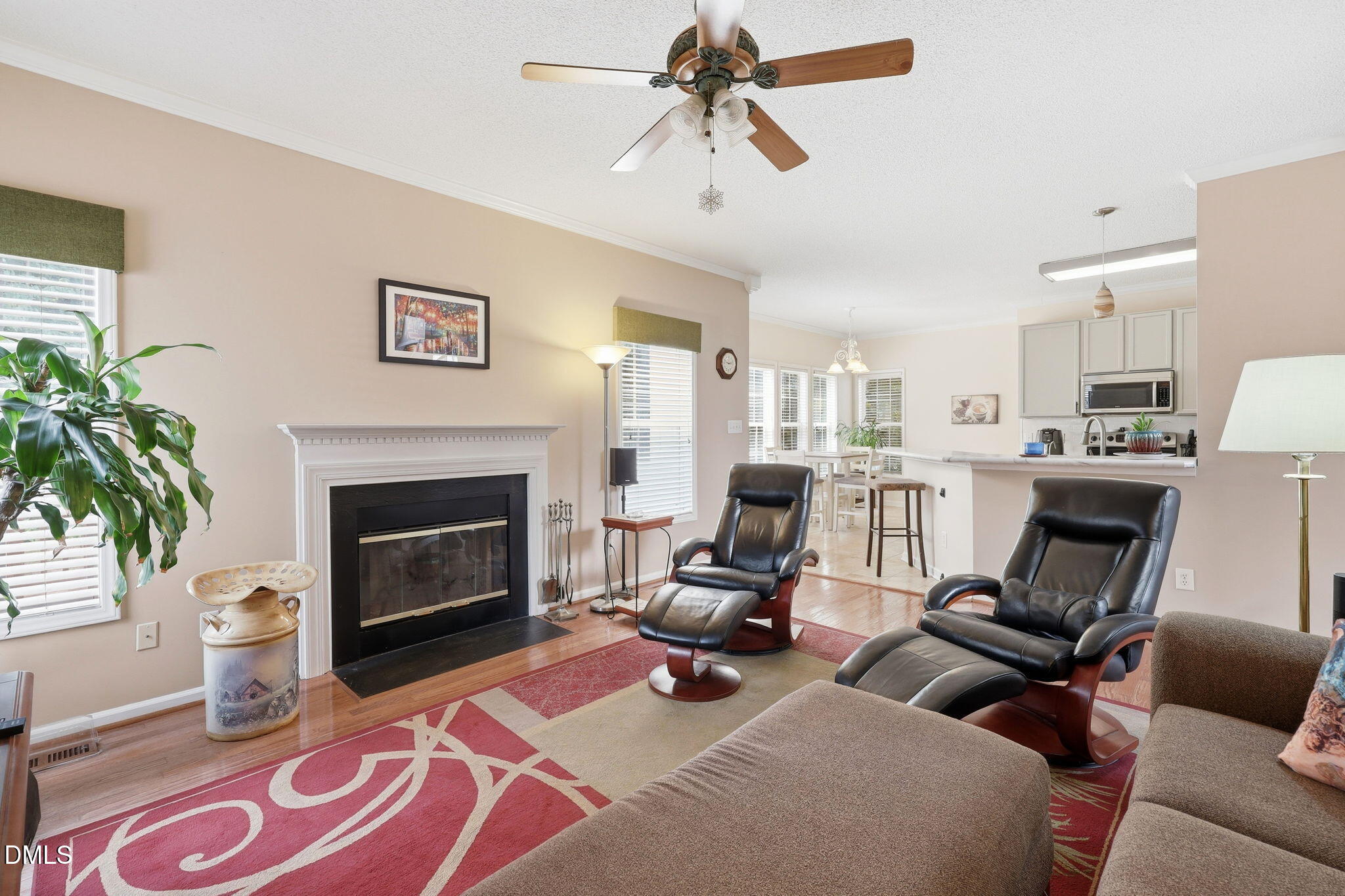 9105 Willow Valley Court Raleigh, NC 27617 - Photo 14 of 51 a work room with furniture and a fireplace