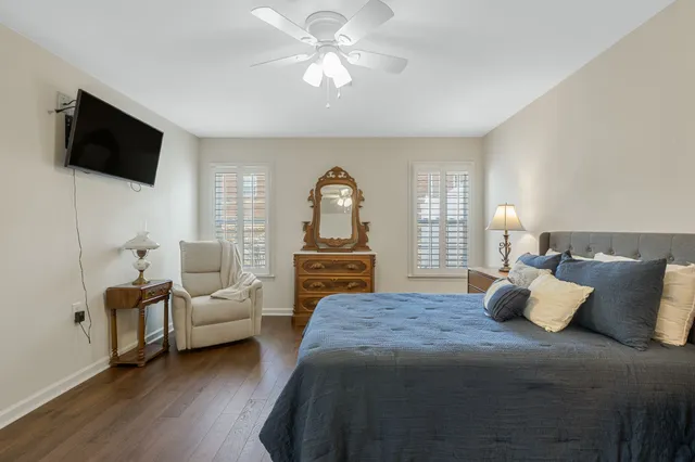 a bedroom with a bed and a lamp with table