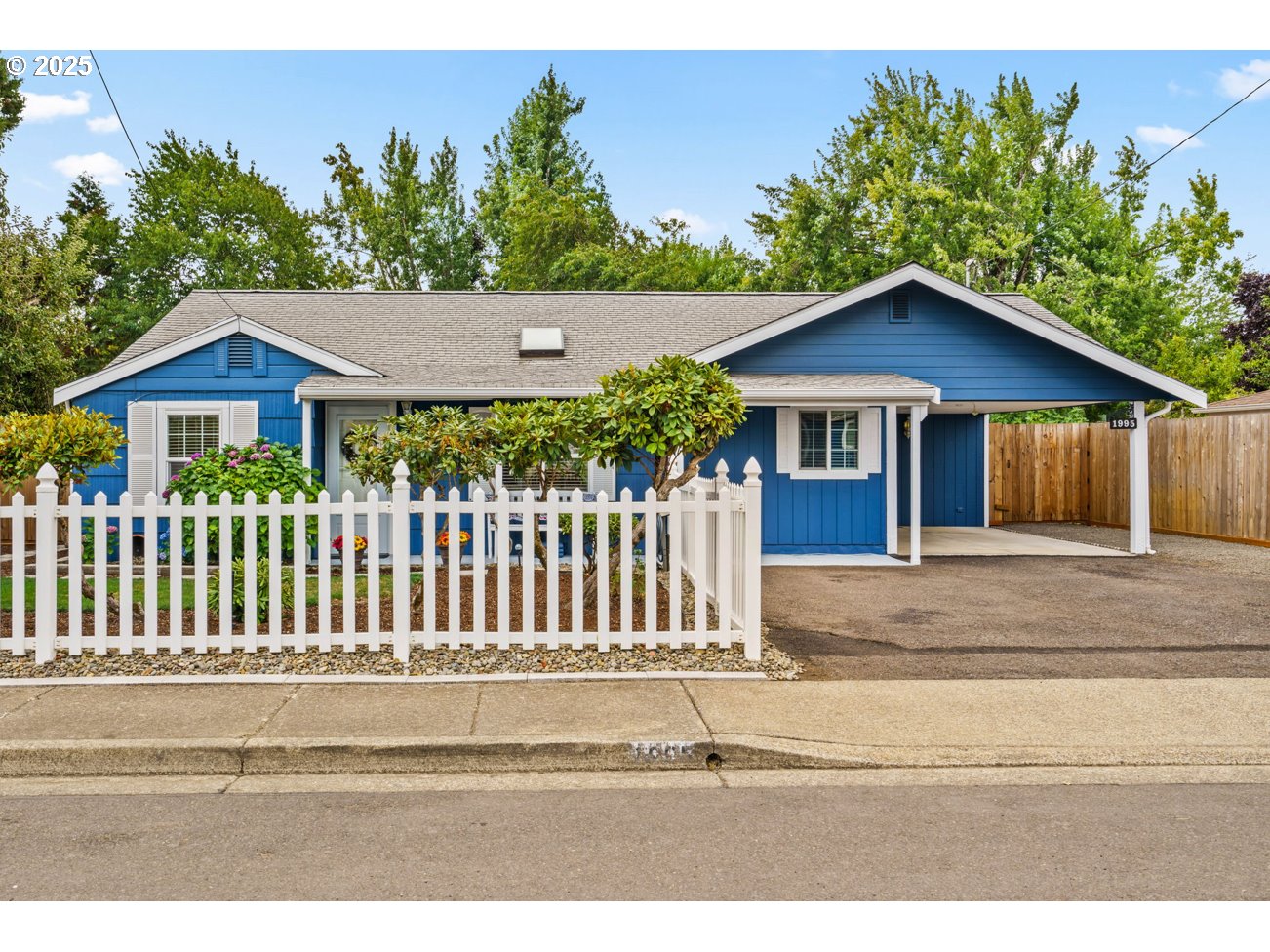 a house with a tree in the background