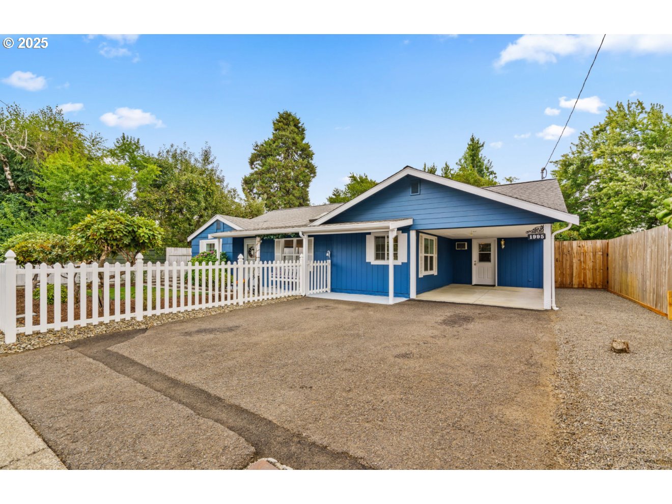 1995 Scott Road Springfield, OR 97477 - Photo 2 of 43 a view of a house with wooden fence