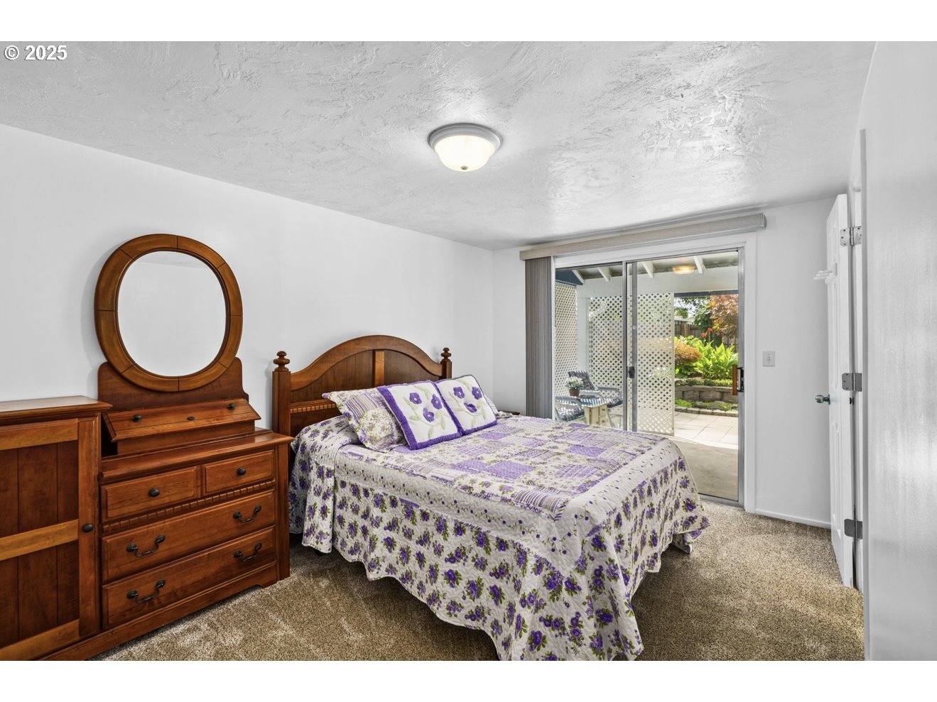1995 Scott Road Springfield, OR 97477 - Photo 27 of 43 a bedroom with a bed a mirror on dresser and a window