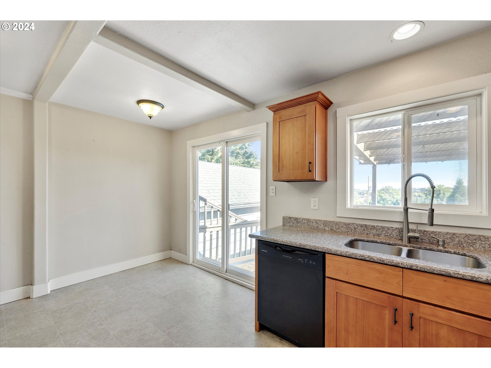 362 Southwest Oak Street Willamina, OR 97396 - Photo 12 of 34 a kitchen with granite countertop a sink and window
