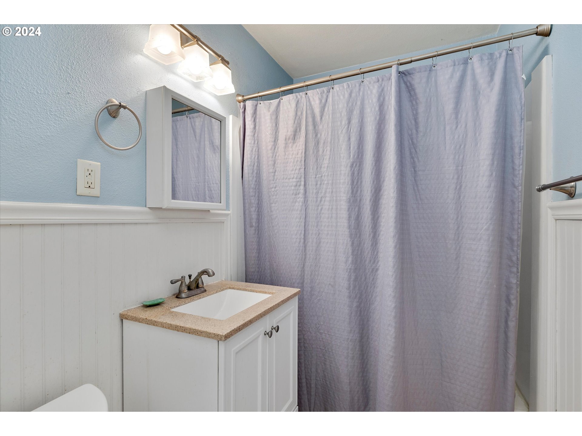 362 Southwest Oak Street Willamina, OR 97396 - Photo 17 of 34 a bathroom with a sink and a mirror