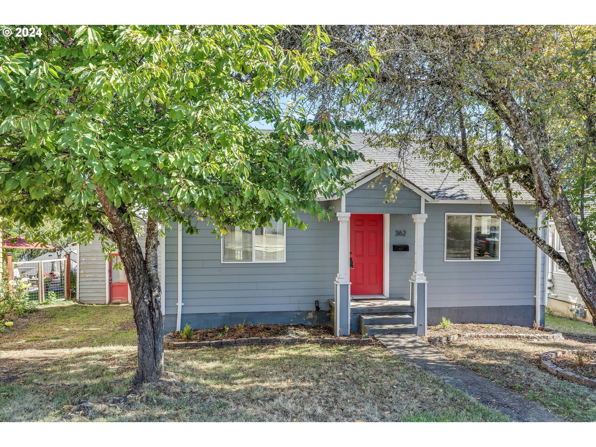 362 Southwest Oak Street Willamina, OR 97396 - Photo 2 of 34 a house that has a tree in front of the house