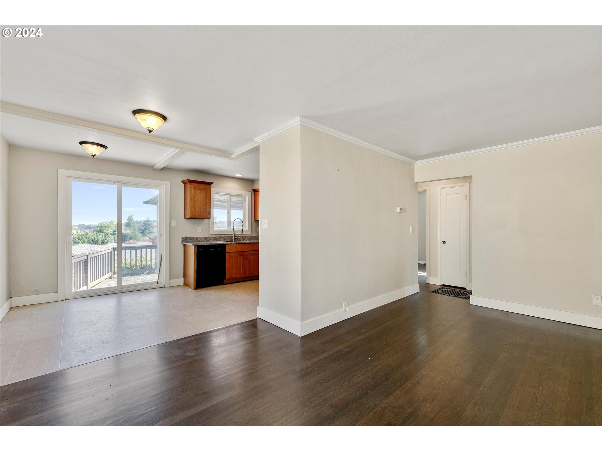 362 Southwest Oak Street Willamina, OR 97396 - Photo 7 of 34 a view of a big room with wooden floor and windows