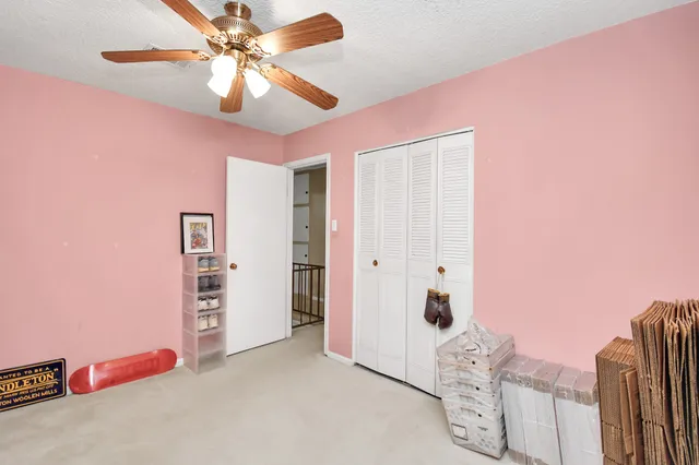 a bedroom with furniture and a chandelier