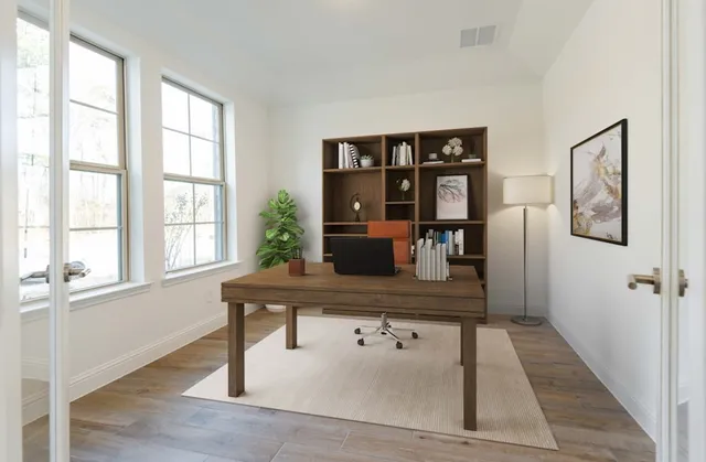 a view of a living room and dining room