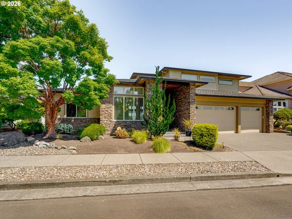 front view of a house with a small yard