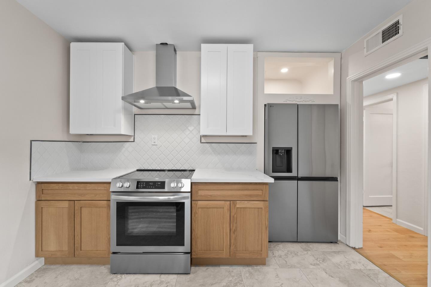 636 West 25th Street Merced, CA 95340 - Photo 20 of 31 a kitchen with stainless steel appliances granite countertop a stove and a refrigerator