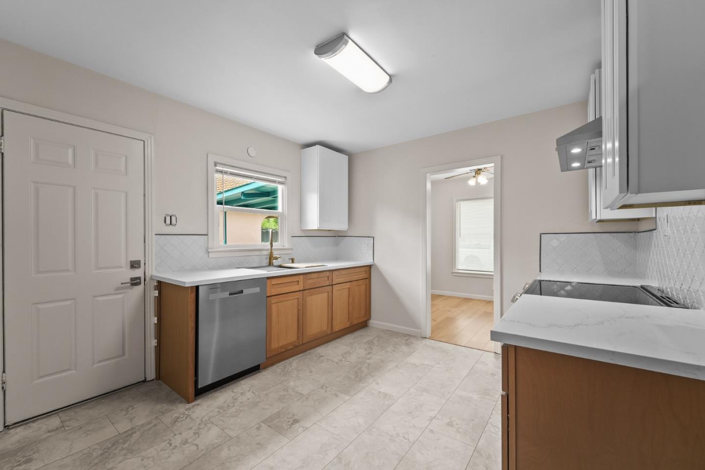 636 West 25th Street Merced, CA 95340 - Photo 21 of 31 a large kitchen with kitchen island a sink stainless steel appliances and a window