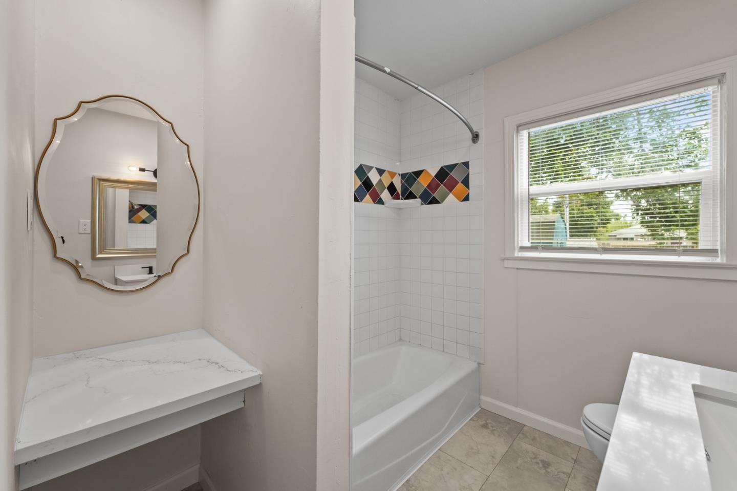 636 West 25th Street Merced, CA 95340 - Photo 22 of 31 a bathroom with a sink a toilet and a bathtub