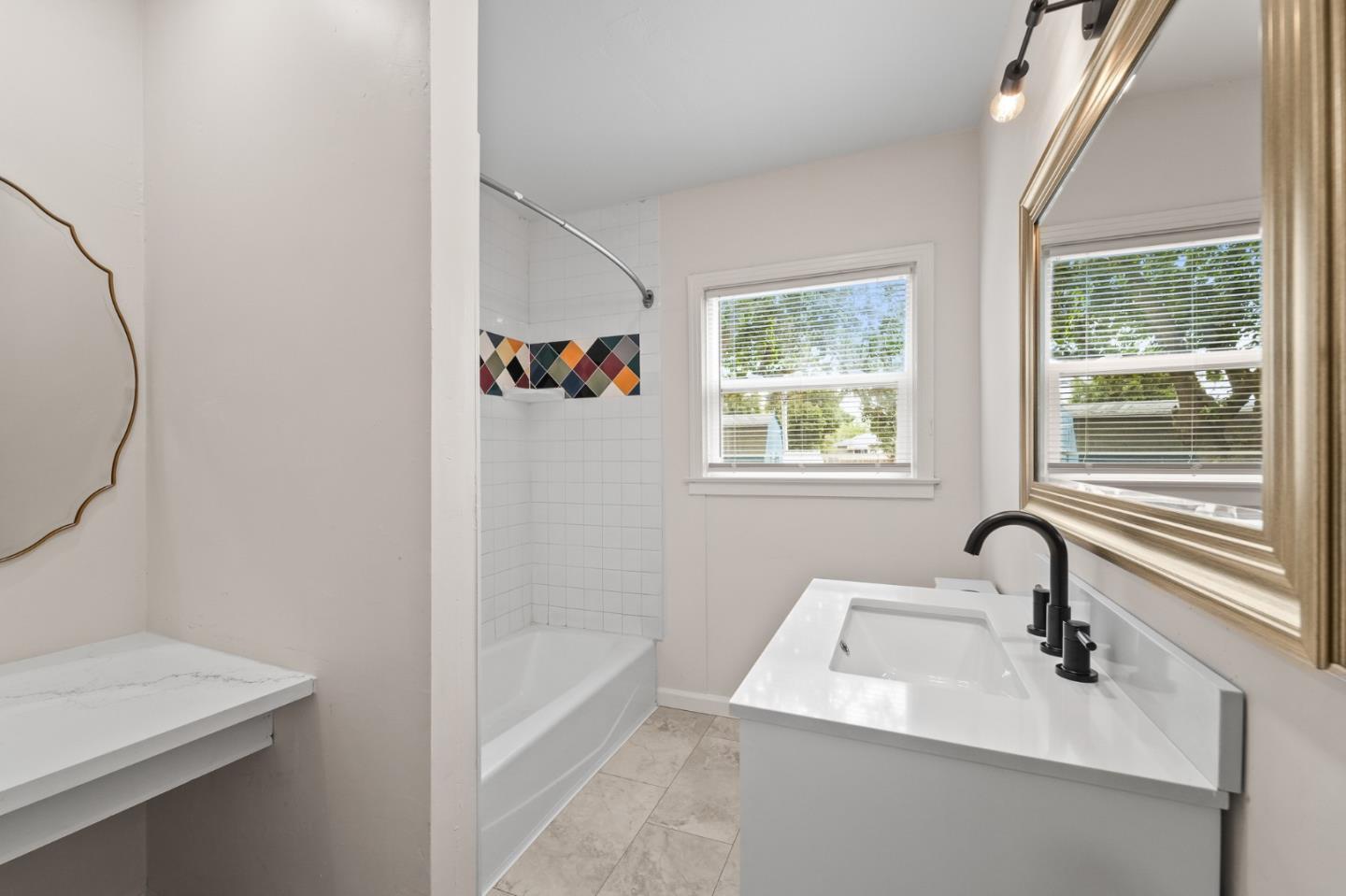 636 West 25th Street Merced, CA 95340 - Photo 24 of 31 a bathroom with a sink and a bathtub