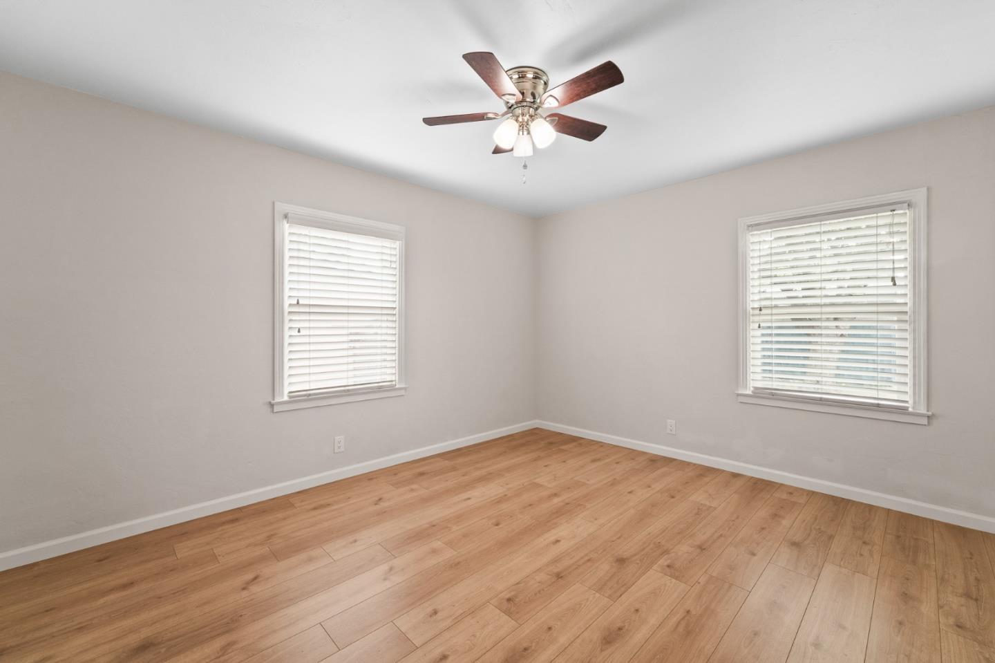 636 West 25th Street Merced, CA 95340 - Photo 25 of 31 a view of an empty room with wooden floor and a window