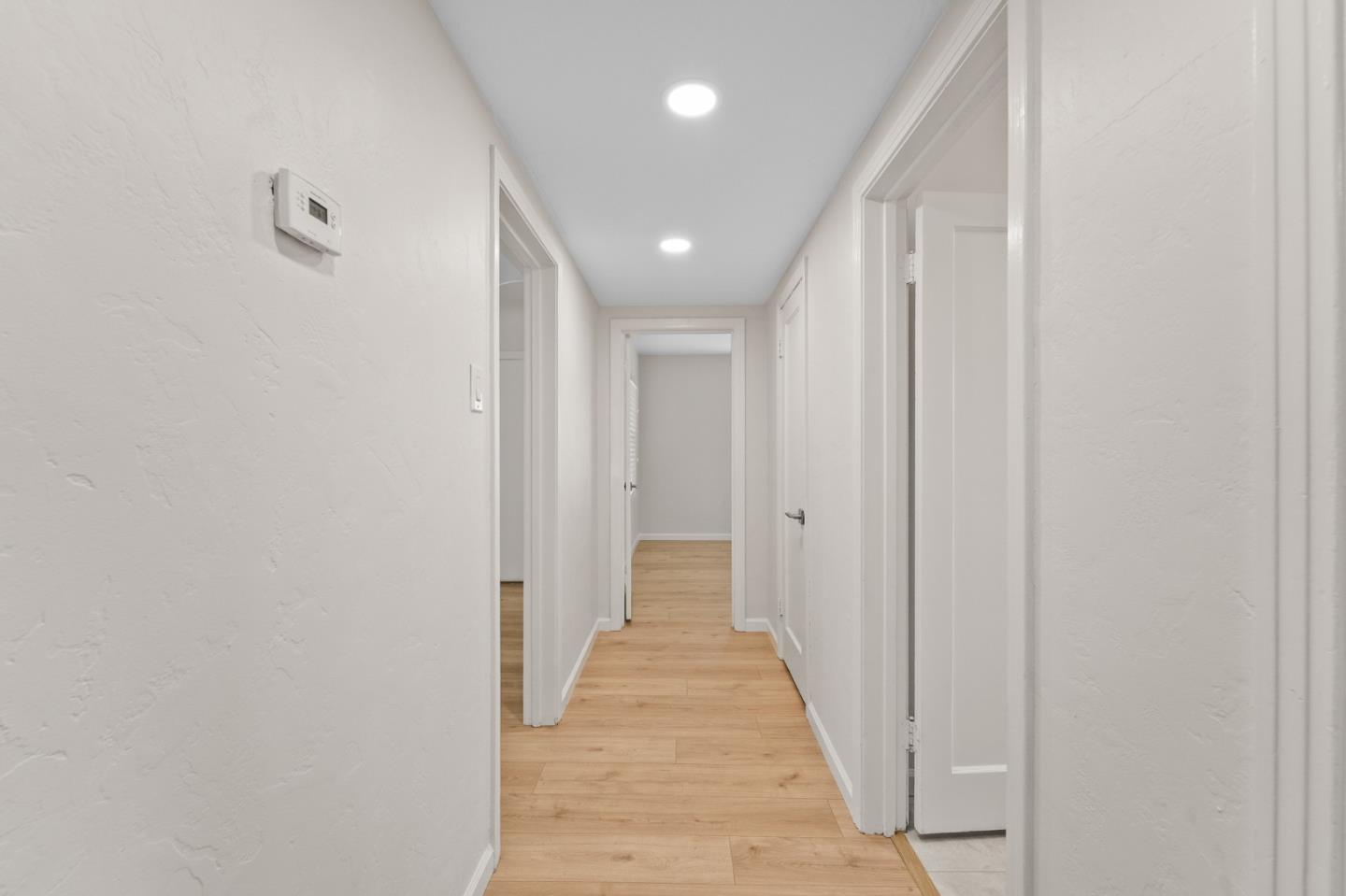 636 West 25th Street Merced, CA 95340 - Photo 26 of 31 a view of a hallway with wooden floor and closet