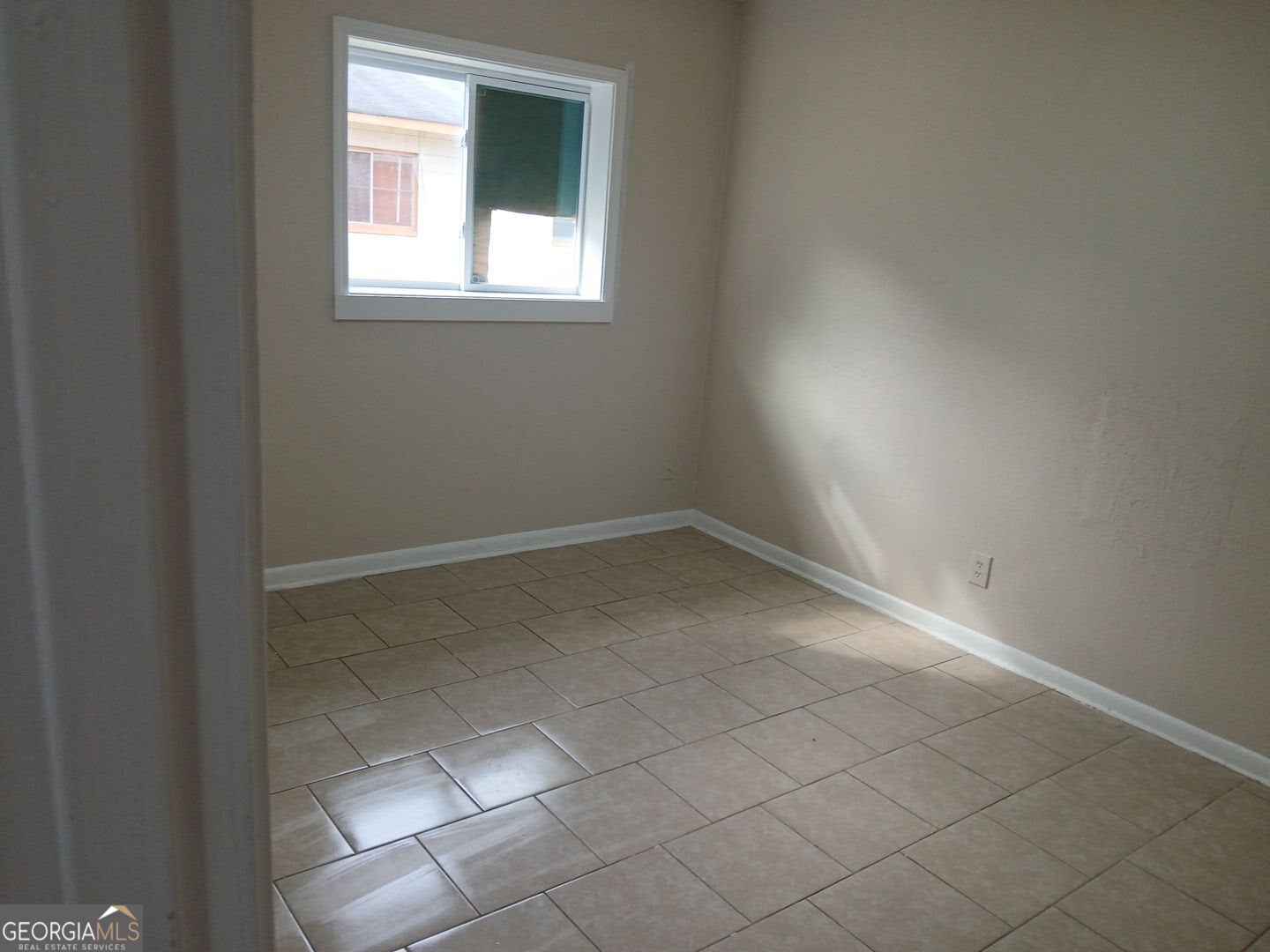 434 Mellon Street Columbus, GA 31903 - Photo 12 of 12 an empty room with a window