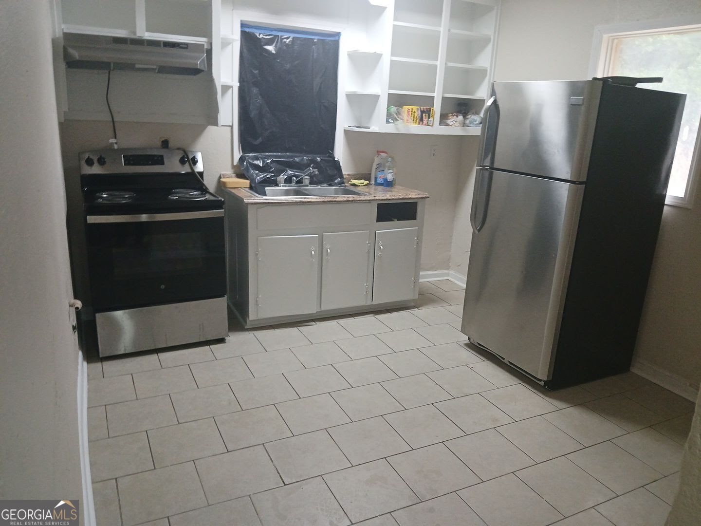 434 Mellon Street Columbus, GA 31903 - Photo 5 of 12 a kitchen with stainless steel appliances a refrigerator and a stove